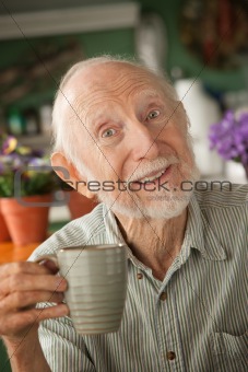 Senior man with mug