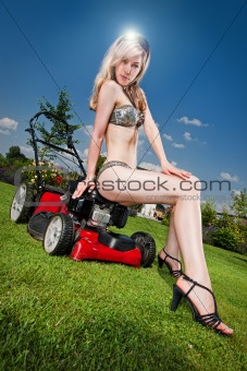 woman on a lawn mower