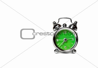 green alarm clock over white