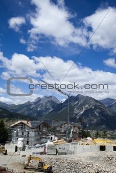 Mountain top under the blue sky with clouds