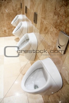 urinals in restroom