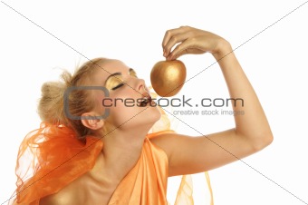 Beautiful woman in gold with gold apple