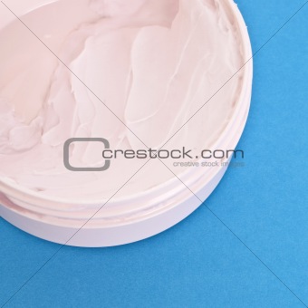 Pink Vitamin E Lotion on a Vibrant Background