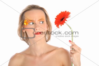 Surprised young woman with flower