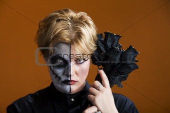 Woman with half painted face