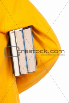 Teenager holds book under arm
