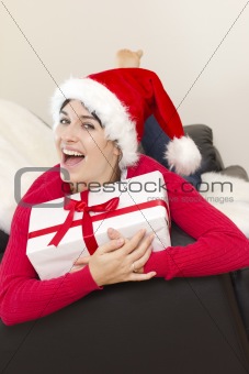 Sexy young woman holding a gift in packing