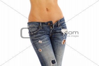 Young woman with bare top wearing worn jeans