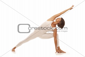 Young woman doing yoga Side Angle Pose