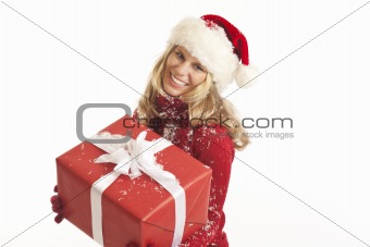 Young woman with Santa hat holding present