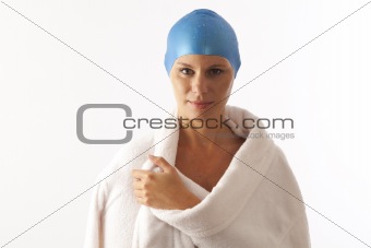 Close up portrait of young woman with swim cap and  swimming towel