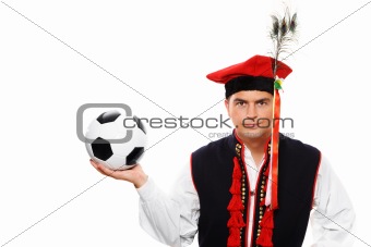 Polish man in a traditional outfit with football