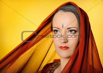 Young beautiful woman in indian traditional jewellary, bindi and