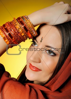 Young beautiful woman in indian traditional jewellary, bindi and