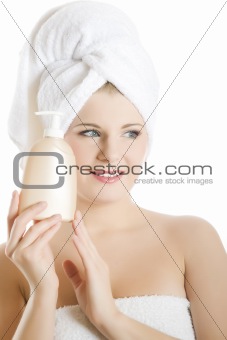 Young beautiful woman with healthy pure skin and white towel 