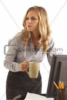 Businesswoman at desk with coffee