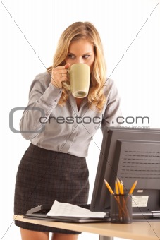Businesswoman at desk with coffee