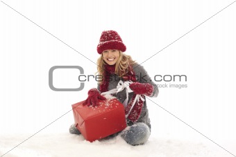 Woman unwrapping gift
