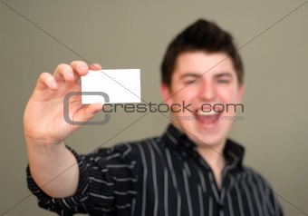 Smiling Young Man with Business Card