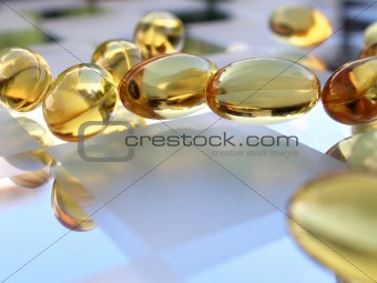 Close up shot of medicine capsules on glass surface