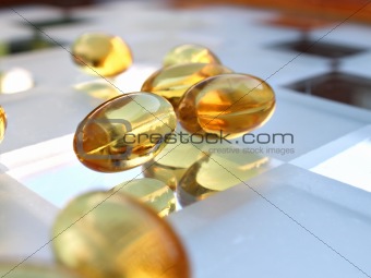 Close up shot of medicine capsule on glass surface