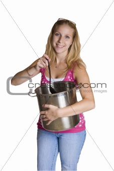A beautiful young lady stirring a pot