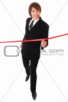 teenage businessman is running through the red line.