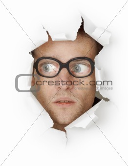 Funny man in an old-fashioned glasses looking out of hole