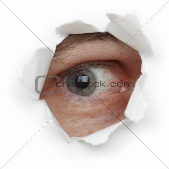 Eye of person in hole close up