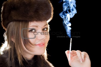 Portrait of the smiling young lady with a cigarette