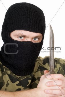 Portrait of the criminal with a knife over white