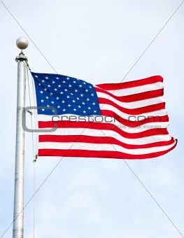 United States Flag Waving In Wind On Flag Pole