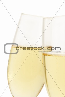 aslope glass of champagne behind other