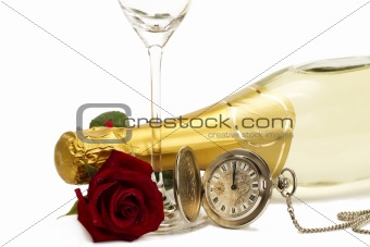 wet red rose under a champagne bottle with a old pocket watch and a empty champagne glass