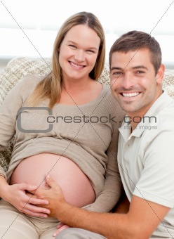 Portrait of future parents in the living room