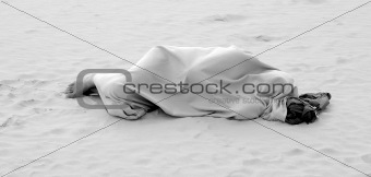 Man sleeping on sea beach