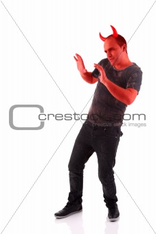 devil, with hands up as a sign of move away, defensive,  isolated on white background. Studio shot