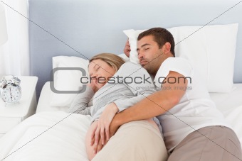 Cute couple of future parents doing a nap