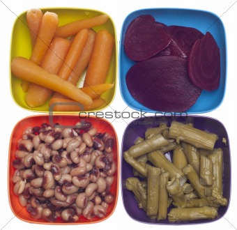 Variety of Canned Vegetables in Colorful Bowls
