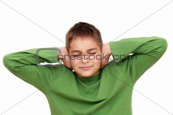 Teenage boy with arms on ears