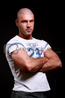 young and muscular man on black