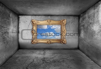 gold frame, framing a blue sky from inside an old dirty room