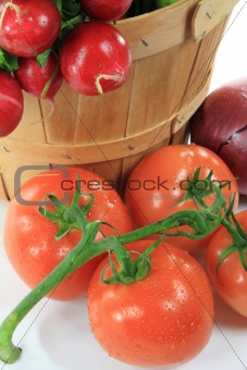Wooden Bushel and Tomatoes on the vine. 