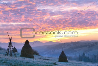 First autumn frosts and sunrise in mountain