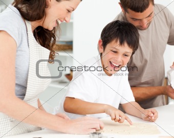 Caucasian family cooking biscuits together