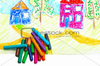Wax crayons and a children's drawing.