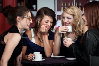 Pretty Girls Laughing in a Cafe