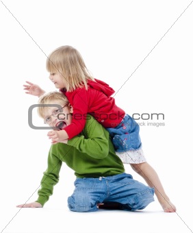 two young siblings fooling around with each other - isolated on white
