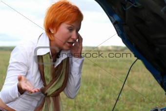 woman with her broken car