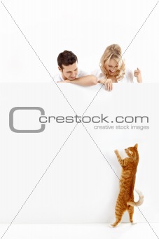People with a cat and an empty banner